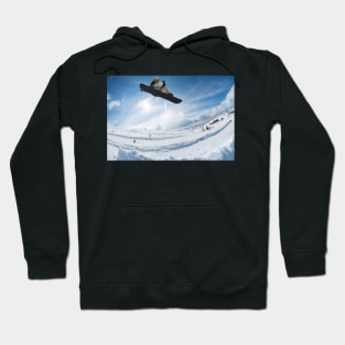 Snowboarder jumping against blue sky Hoodie